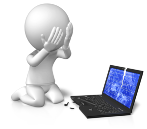 person sad in front of a broken laptop